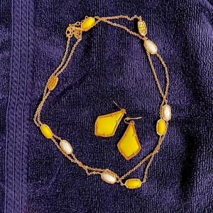 Rose gold with yellow and white stones.  Kendra Scott necklace and earrings